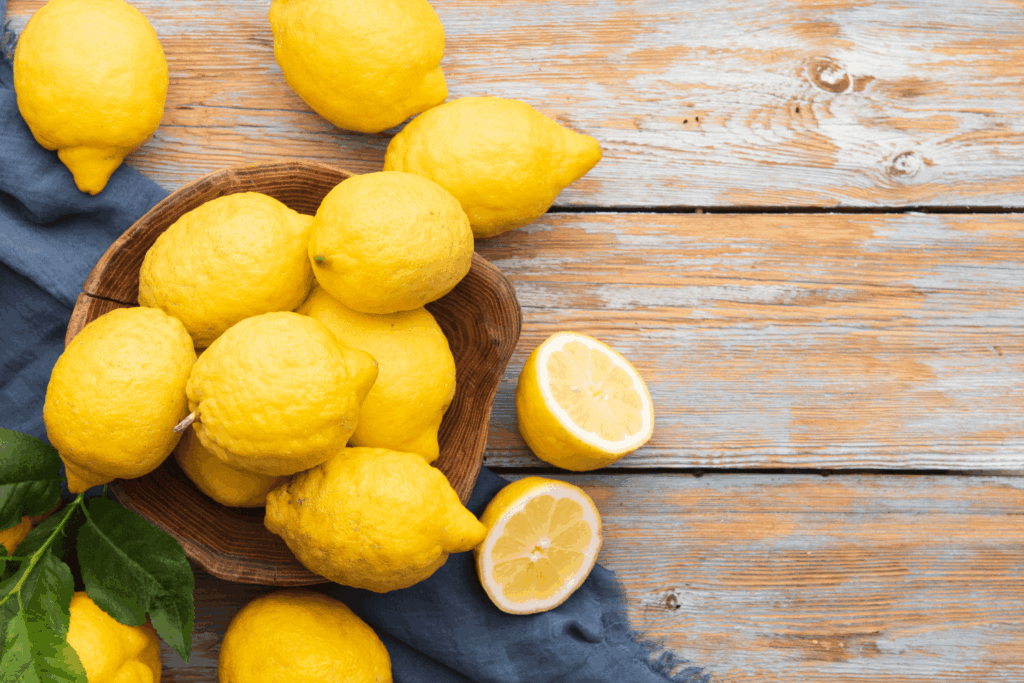 Freshly picked organic lemons on a wooden table