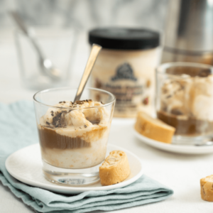 Small plate with maple cookie affogato with a biscotti.